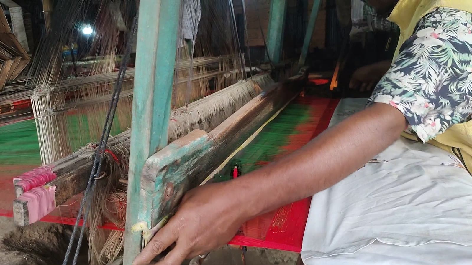 A Bangladeshi artisan weaving a handloom saree